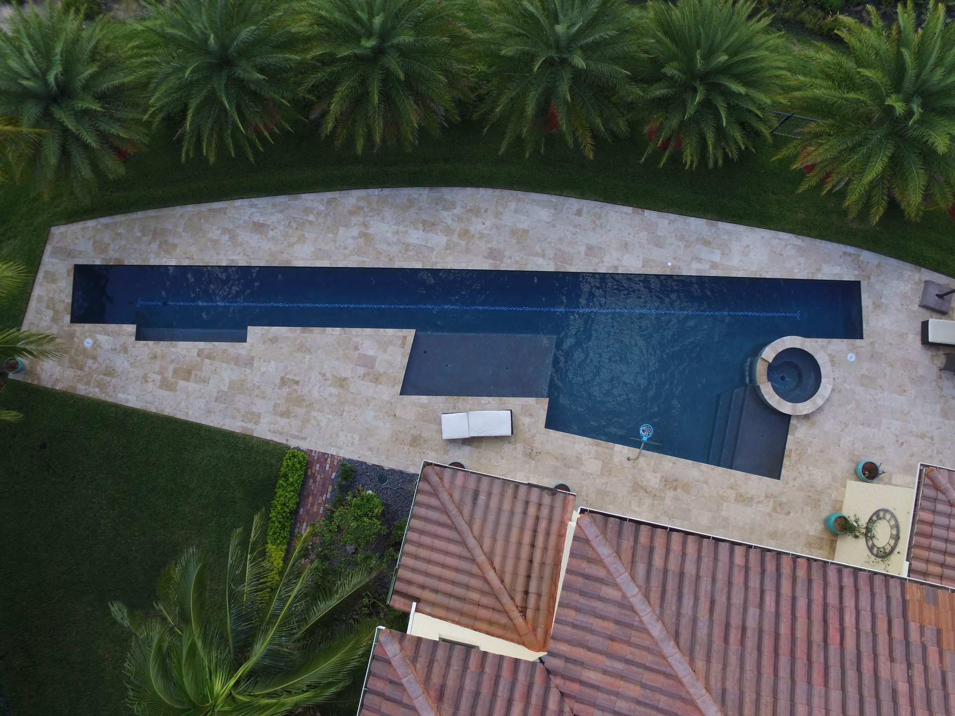 Custom pool project with landscaped surroundings